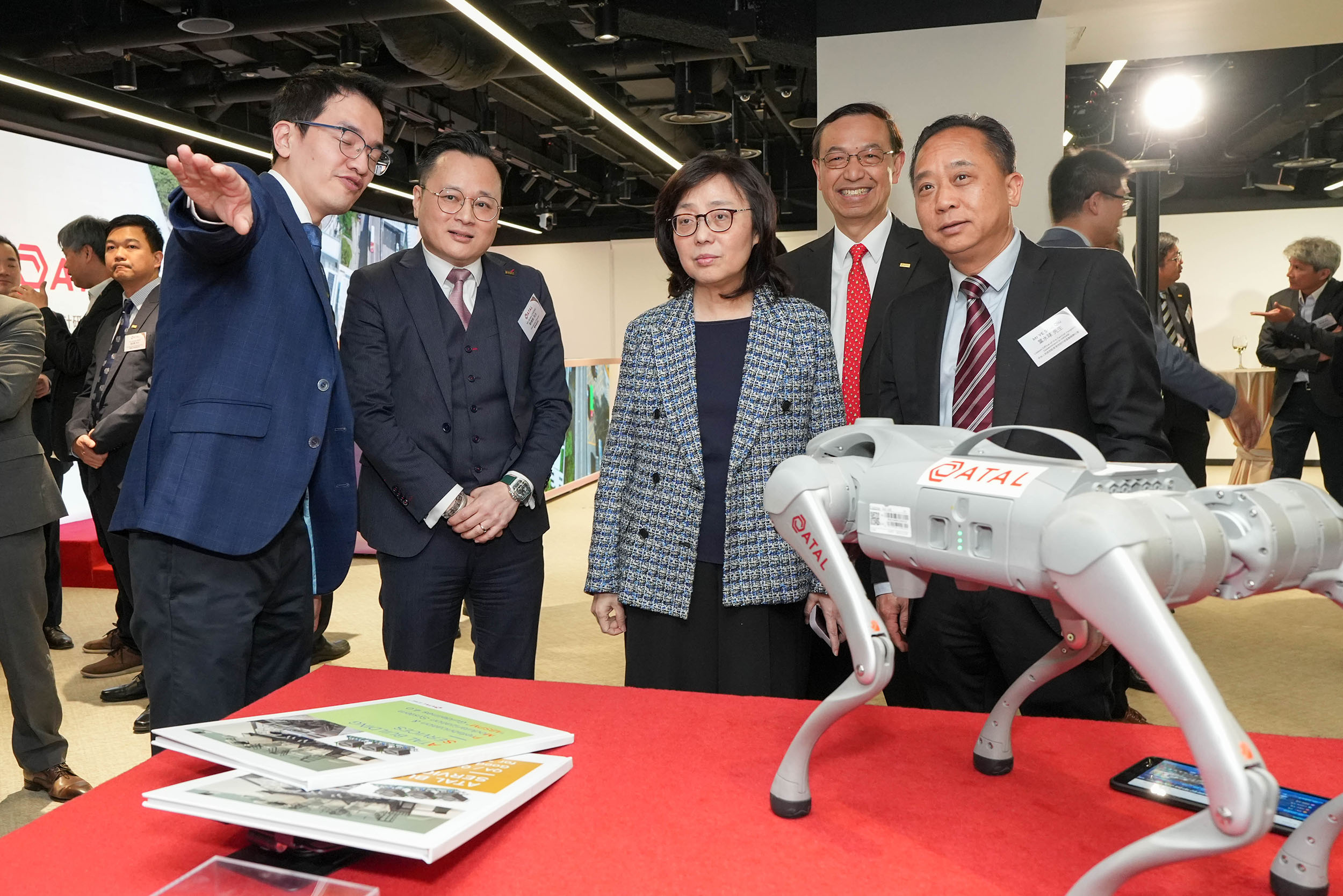 Photo 5: The Secretary for Development The Hon Bernadette Linn (centre of photo 5) and Mr Ye Shui Qiu, Deputy Director-General, Department of Educational, Scientific and Technological Affairs, Liaison Office of the Central People's Government in the Hong Kong SAR (first right of photo 5) tour the ATAL Design, Research and Training Centre, accompanied by ATAL Engineering Group Chairman Dr Kim Mak (second right of photo 5), and Managing Director Mr Brian Cheng (second left of photo 5). The visit showcases ATAL portfolio of advanced construction methodologies and innovative technologies, which help spearhead intelligent and low-carbon transformation across the engineering sector.