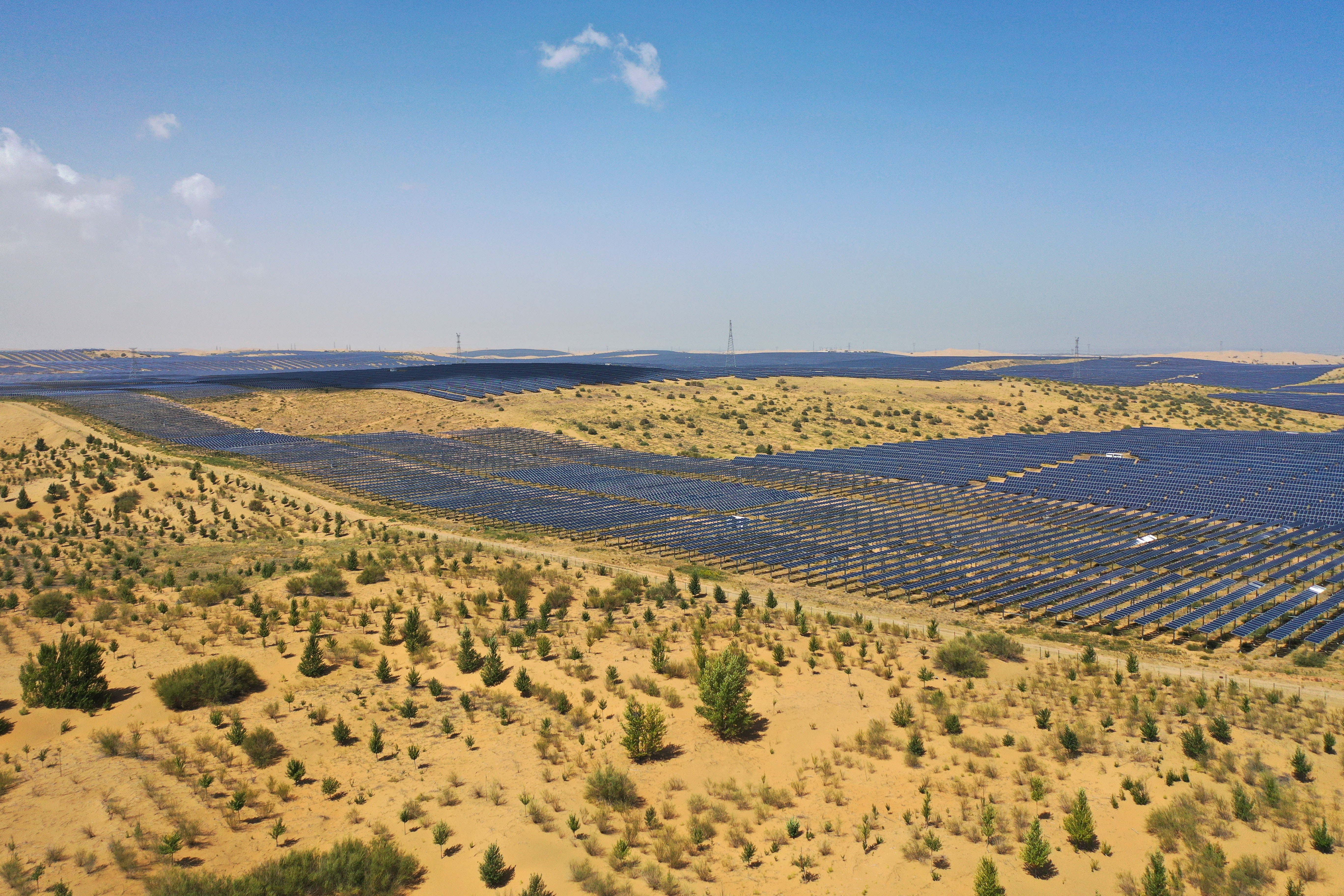 An aerial drone photo taken on Sept. 3, 2025 shows a photovoltaic and desertification control project in Kubuqi Desert, north China's Inner Mongolia Autonomous Region.