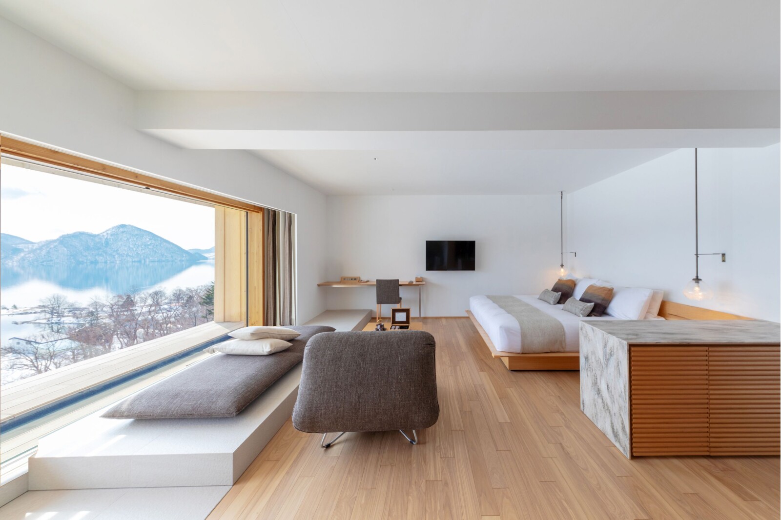 Dusit International brings its Dusit Collection  brand to Japan with the opening of a Kengo Kuma-designed lakeside retreat in Hokkaido