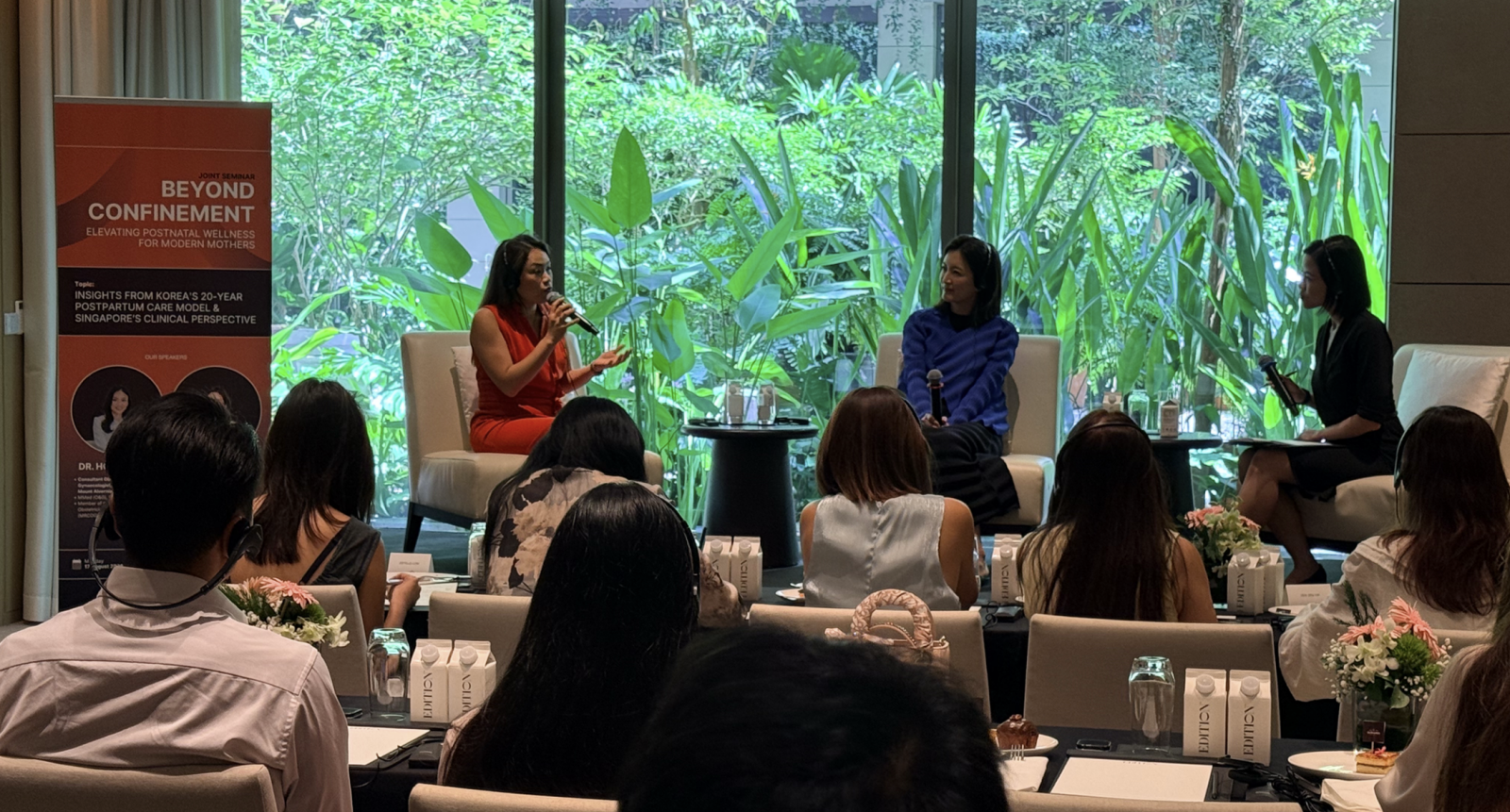 Dr Park Jeong-mi and Dr Ho Ping Ling discussing the evolving postpartum recovery needs of modern mothers at DeRAMA Singapore's Joint Postnatal Recovery Seminar, held at The Singapore EDITION on 17 August 2026.