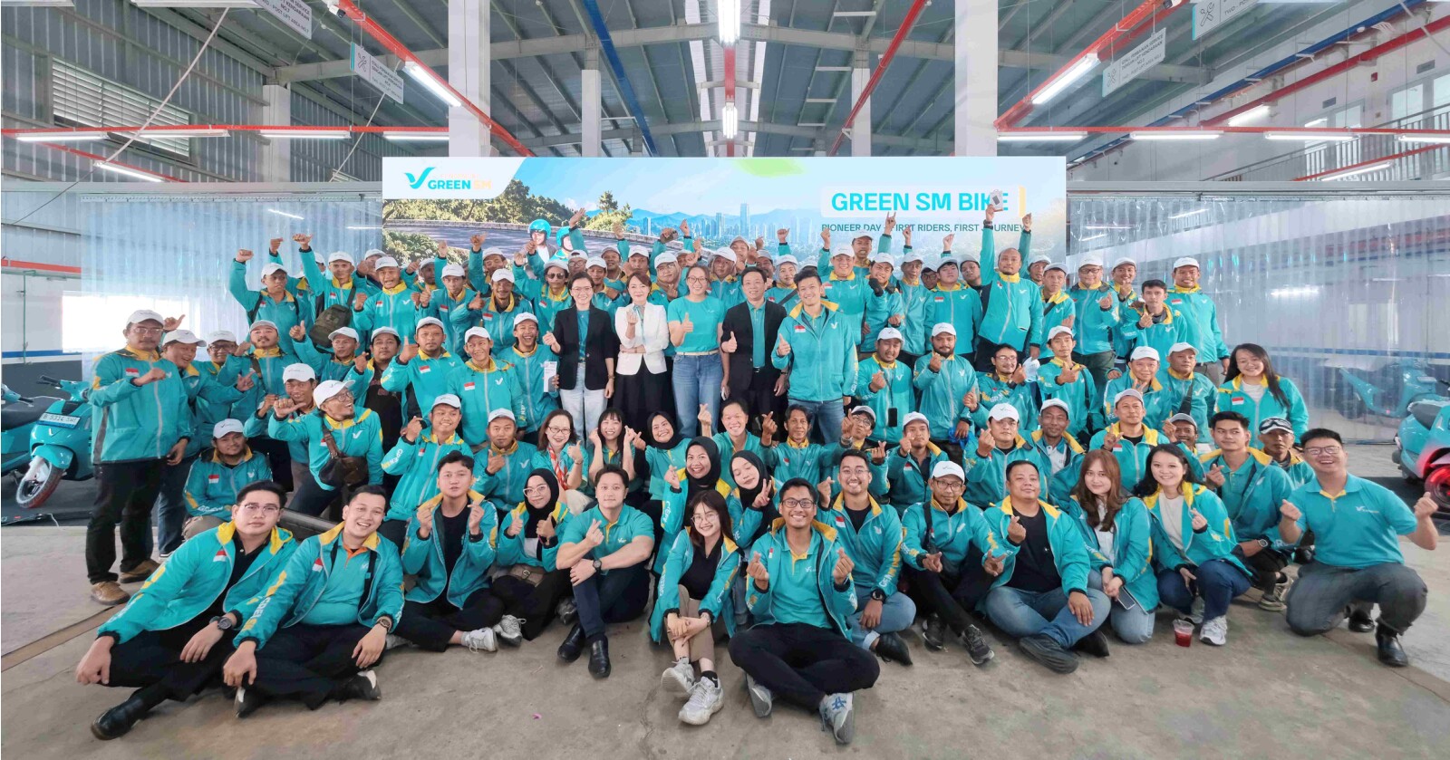 Green SM's pioneer drivers mark the launch of the company's electric motorbike service in Jakarta.